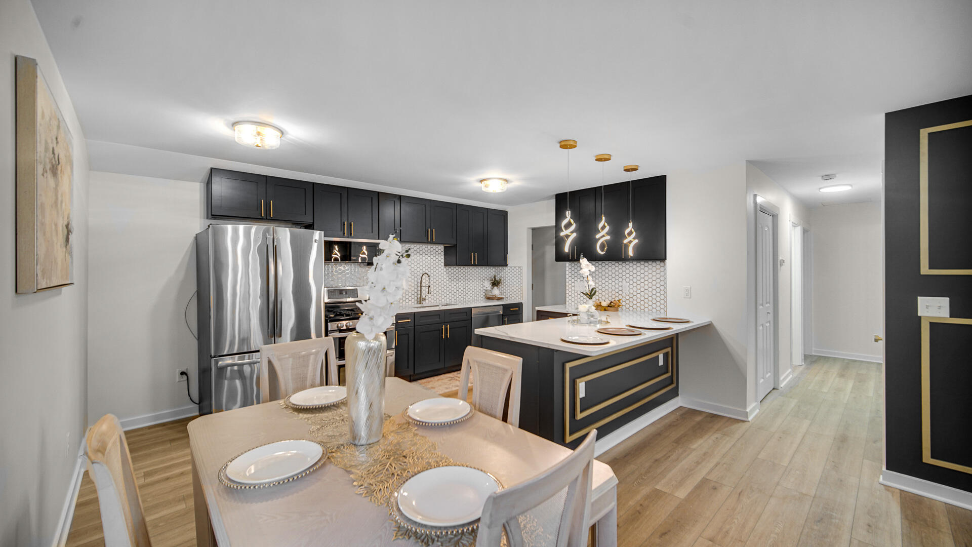 1330 Idaho Street Gary, IN 46403 - Photo 7 of 23 a kitchen with stainless steel appliances a stove a refrigerator and a dining table