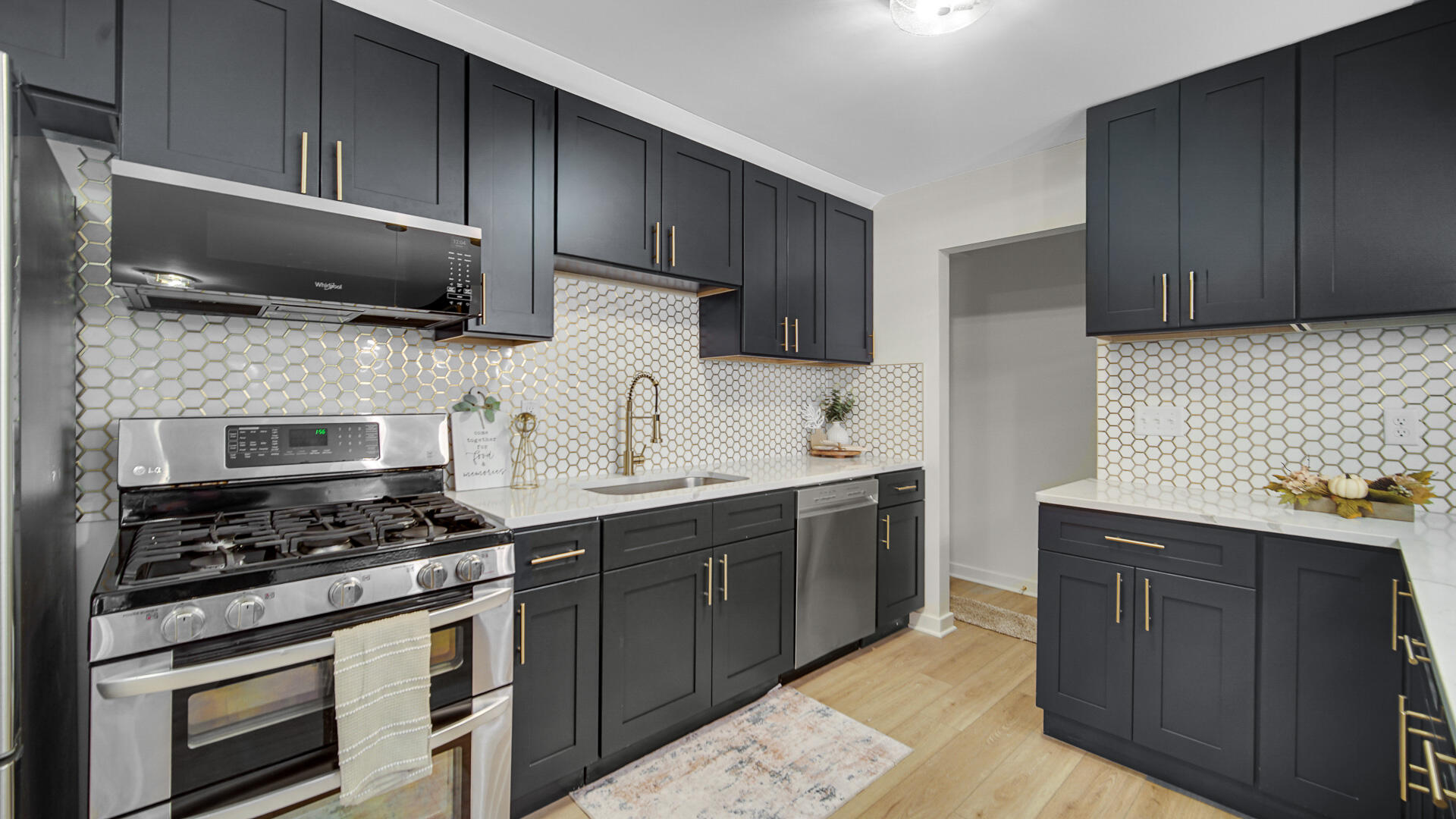 1330 Idaho Street Gary, IN 46403 - Photo 8 of 23 a kitchen with a sink stove and microwave