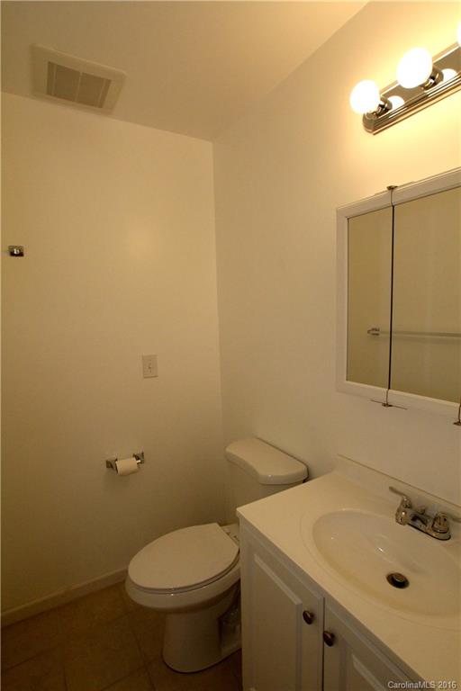 825 Manhasset Road Charlotte, NC 28209 - Photo 12 of 20 a bathroom with a sink and a toilet