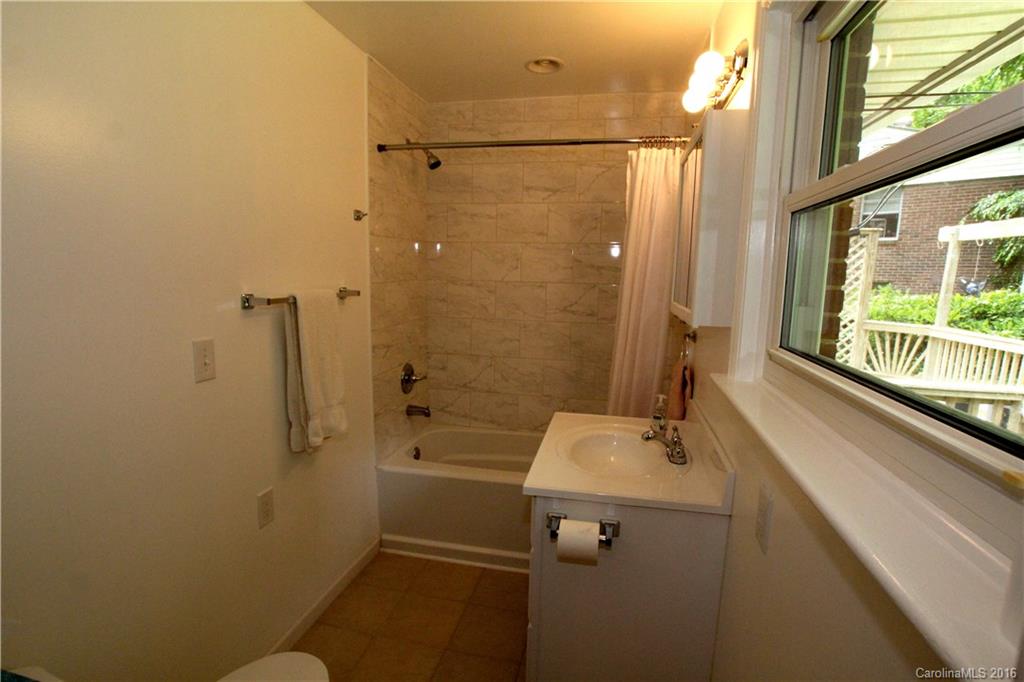 825 Manhasset Road Charlotte, NC 28209 - Photo 16 of 20 a bathroom with a sink and a shower