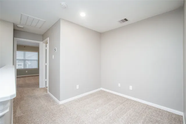 a bathroom with a granite countertop sink toilet mirror and shower