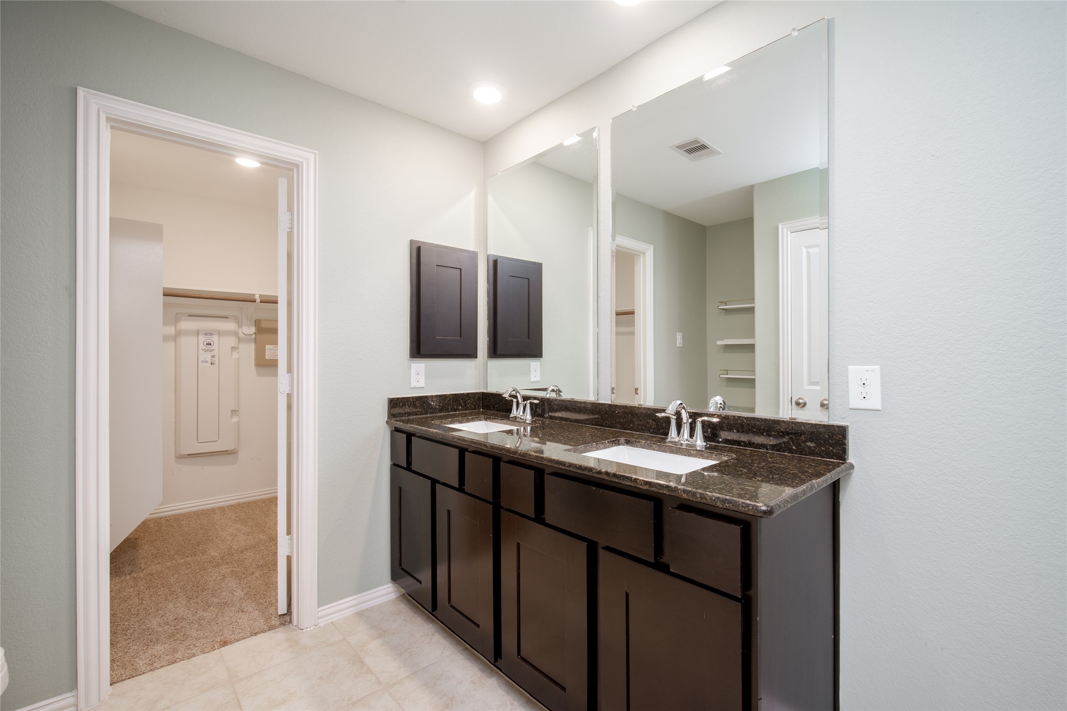 1826 Ryon Falls Drive Richmond, TX 77469 - Photo 28 of 35 a bathroom with a granite countertop sink and a mirror