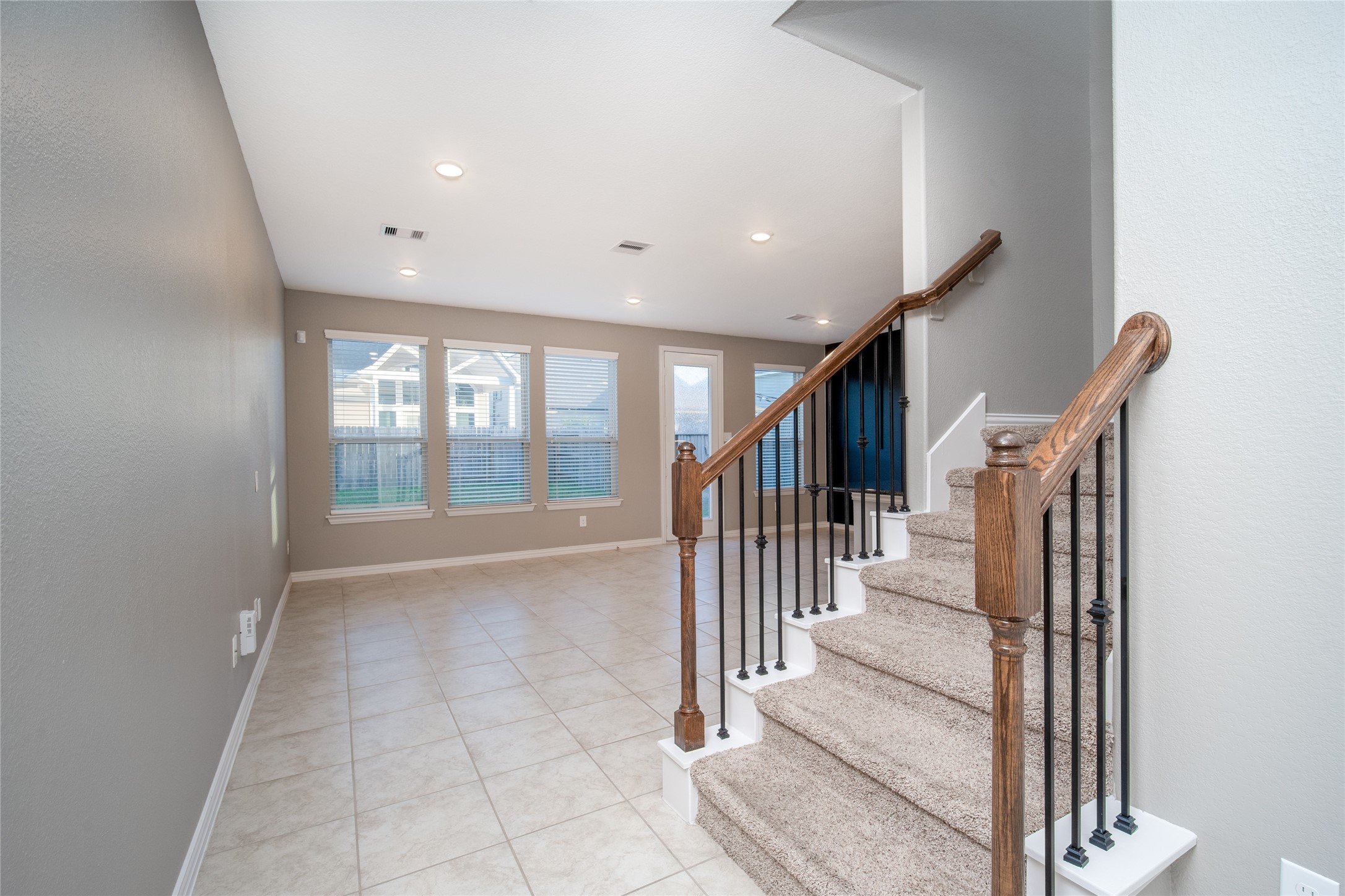 1826 Ryon Falls Drive Richmond, TX 77469 - Photo 6 of 35 a view of a hallway with wooden floor and staircase