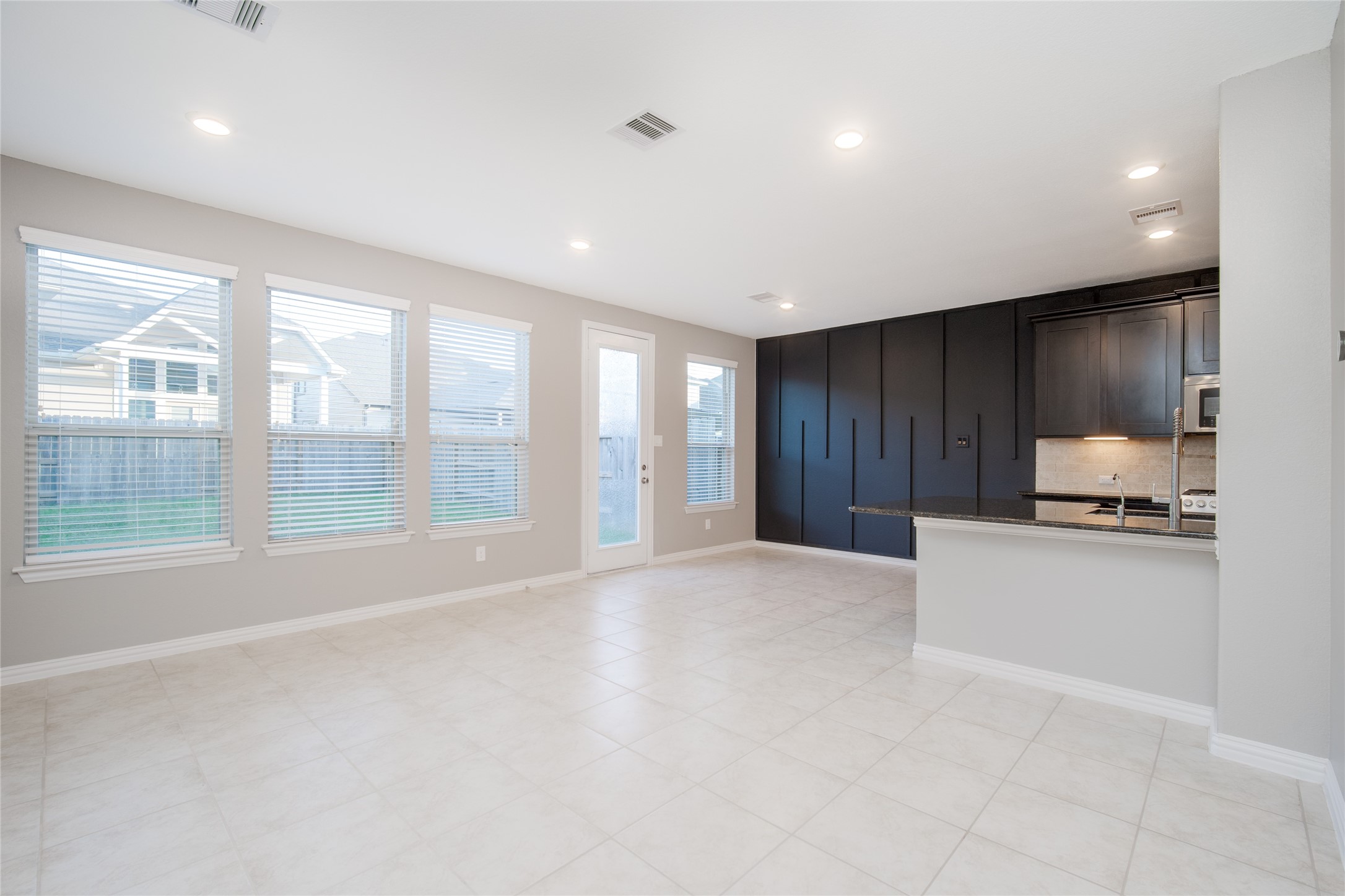 1826 Ryon Falls Drive Richmond, TX 77469 - Photo 7 of 35 a large white kitchen with a large window