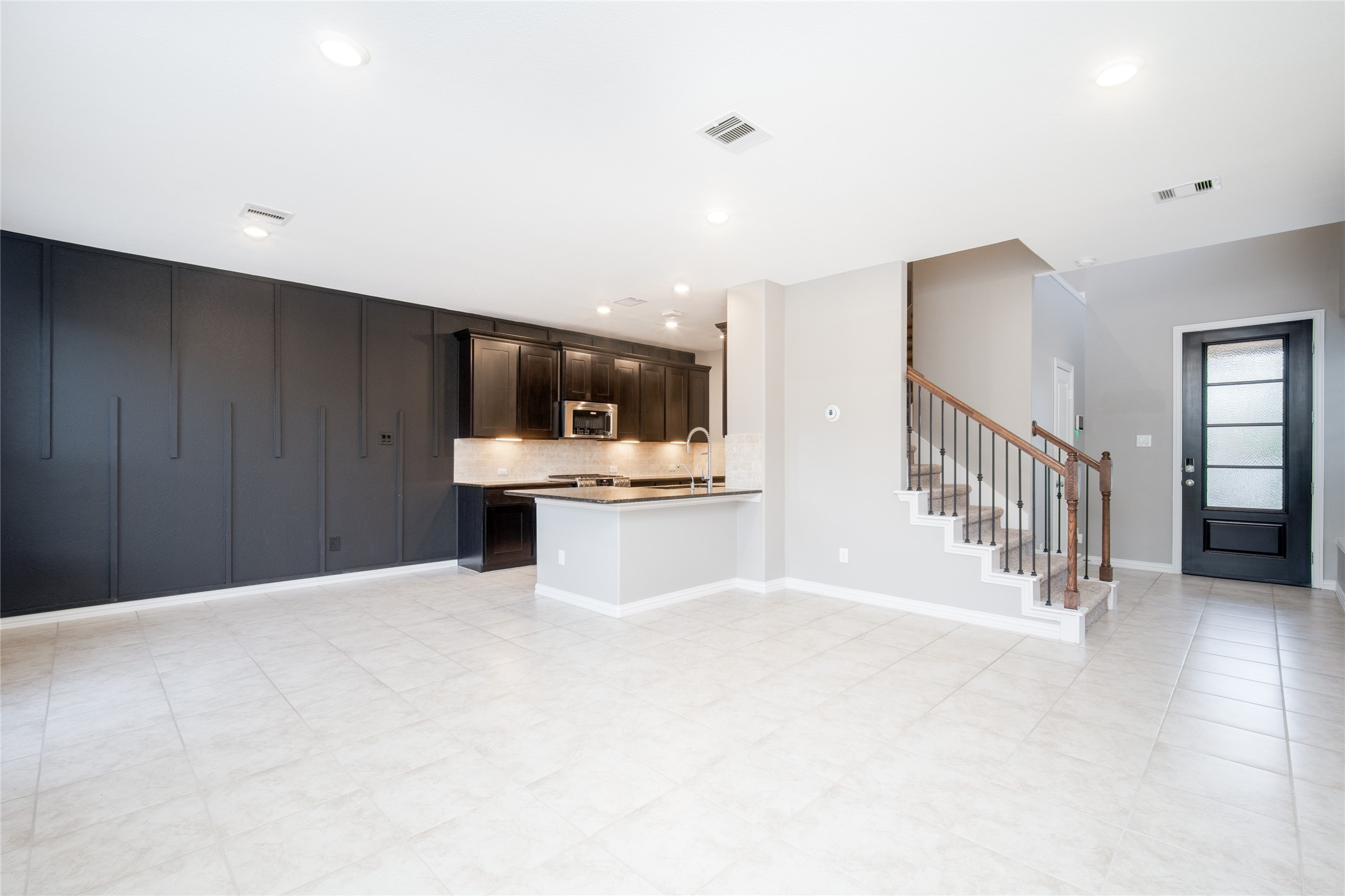1826 Ryon Falls Drive Richmond, TX 77469 - Photo 8 of 35 a view of an empty room with kitchen and a window