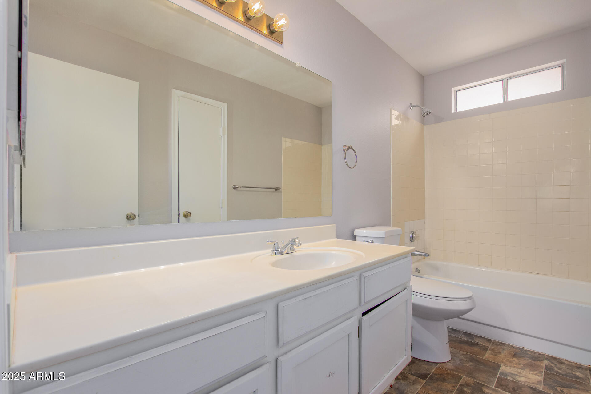 10015 North 66th Drive Glendale, AZ 85302 - Photo 11 of 20 a bathroom with a sink a toilet and a bathtub