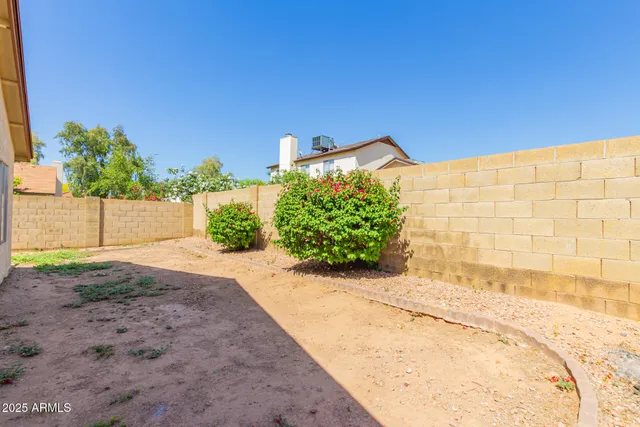 a view of a backyard of the house