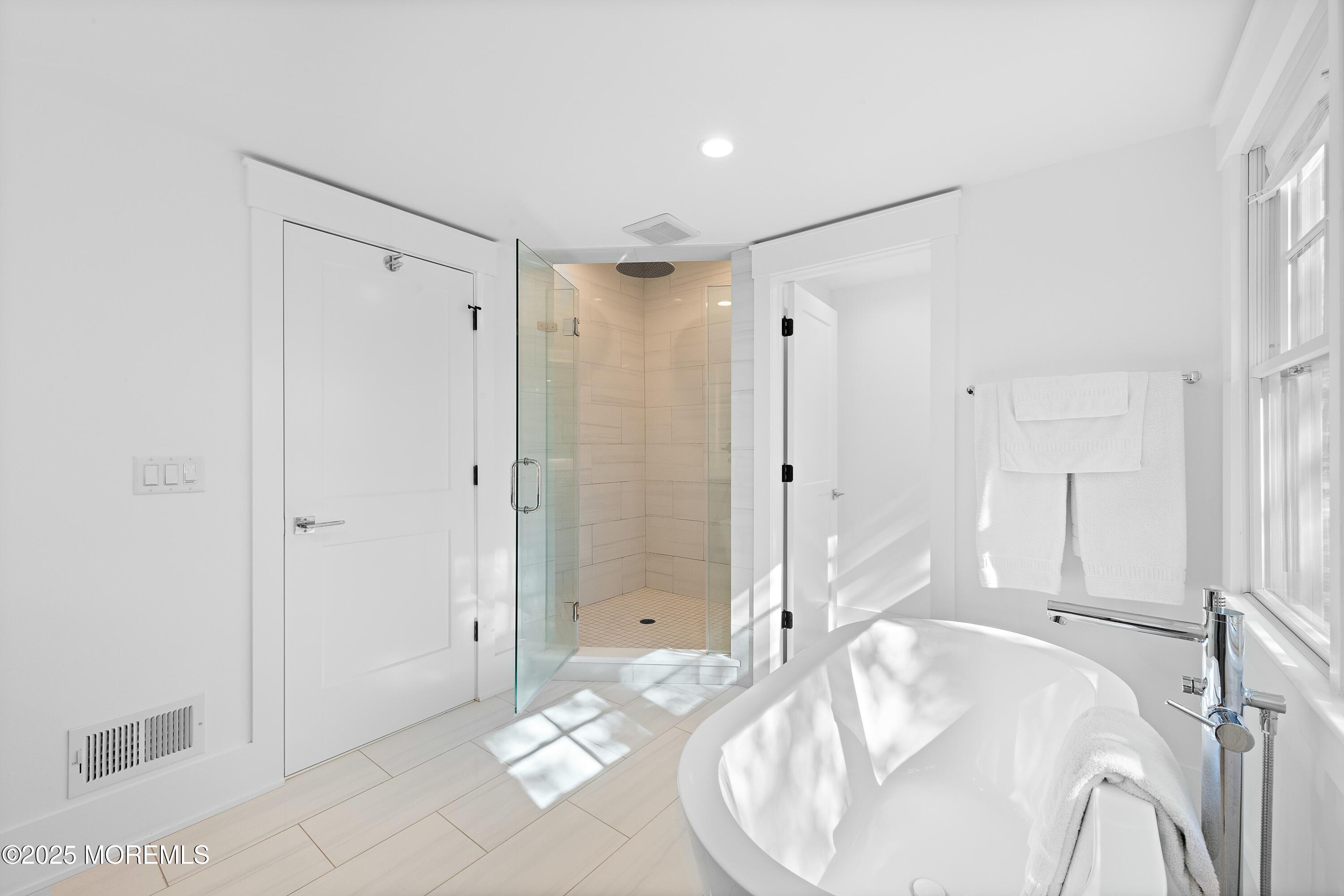 615 Harding Road Little Silver, NJ 07739 - Photo 37 of 94 a spacious bathroom with a granite countertop sink a shower and a mirror
