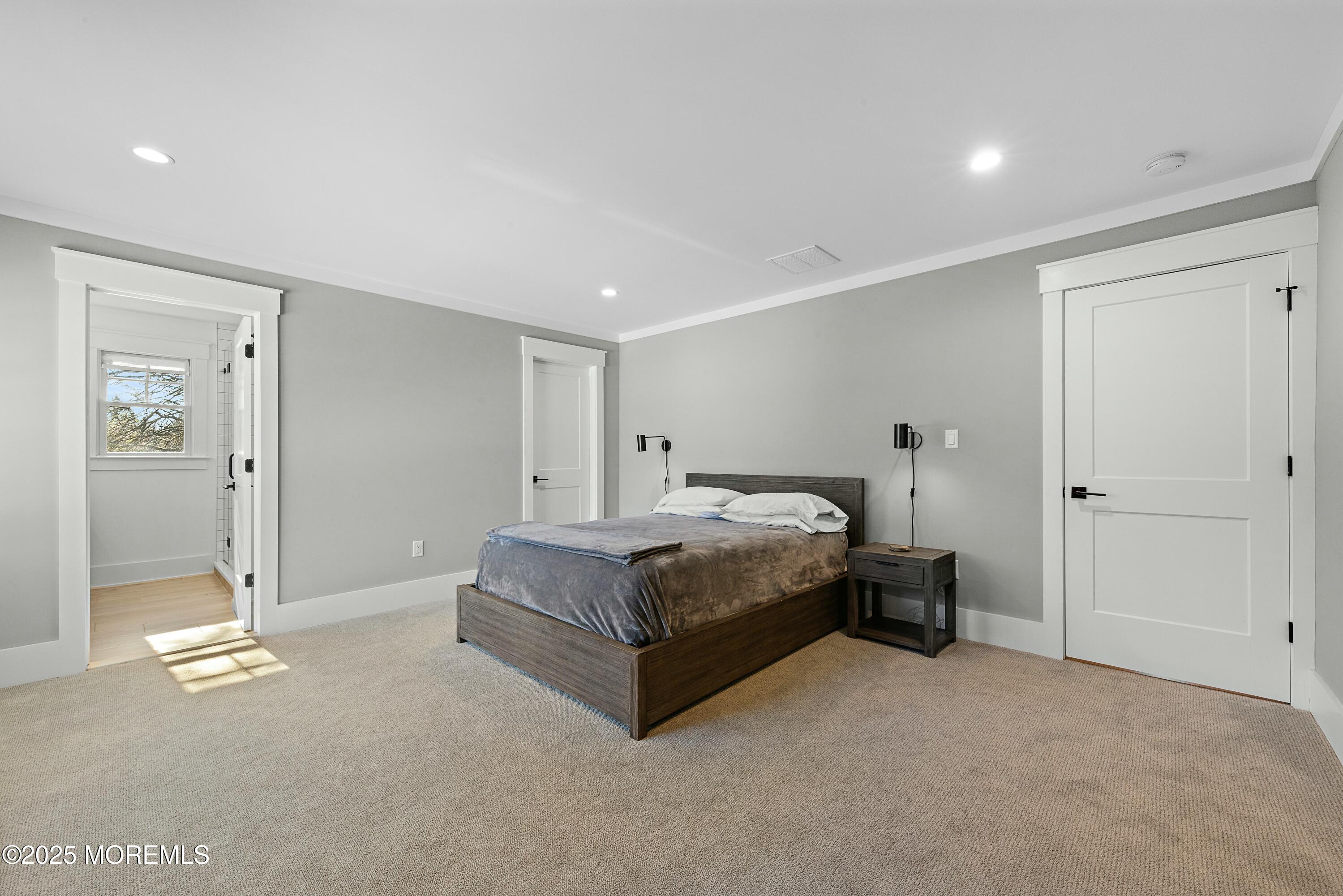 615 Harding Road Little Silver, NJ 07739 - Photo 43 of 94 a spacious bedroom with a bed and a table