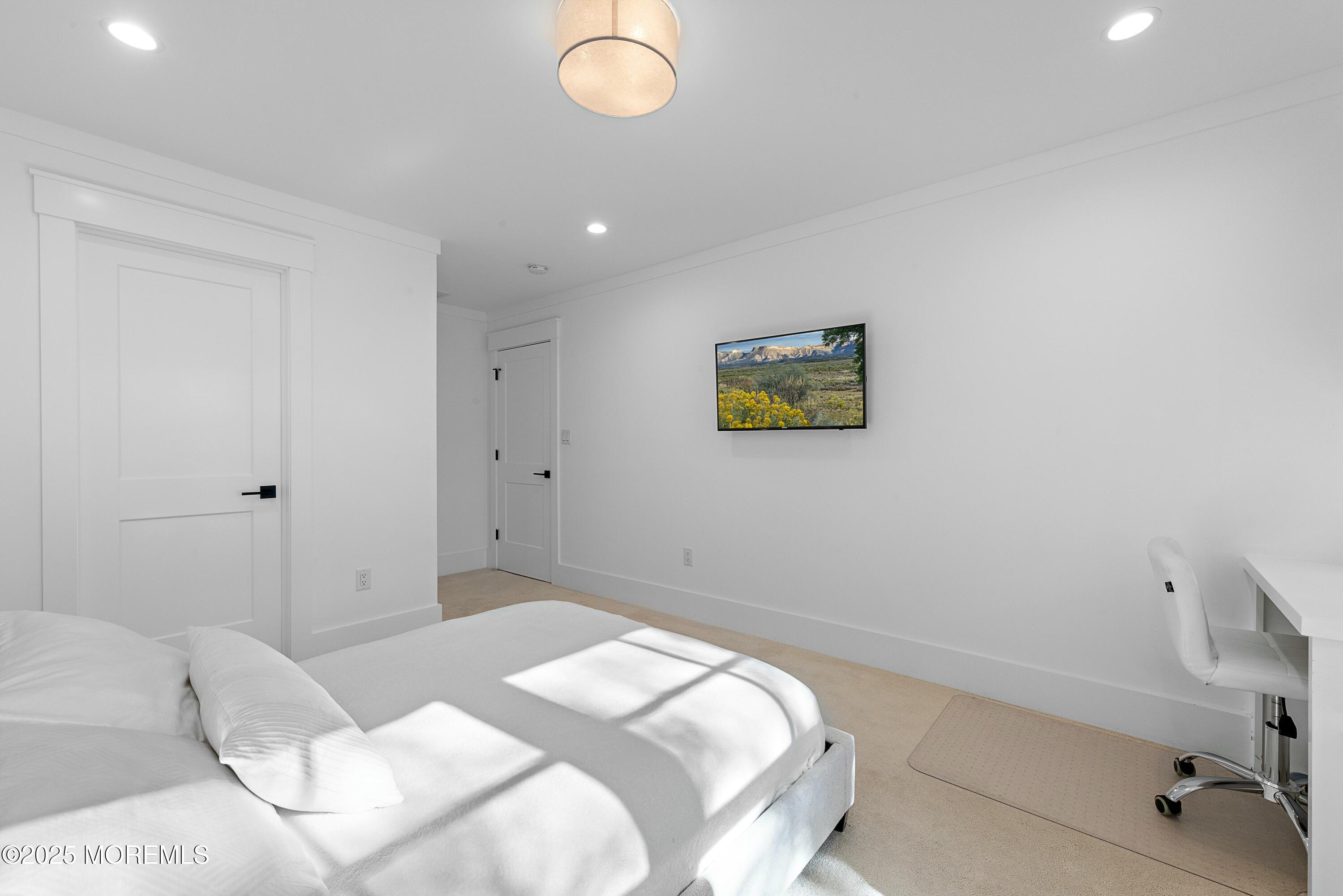615 Harding Road Little Silver, NJ 07739 - Photo 50 of 94 a bedroom with a bed and a painting on the wall