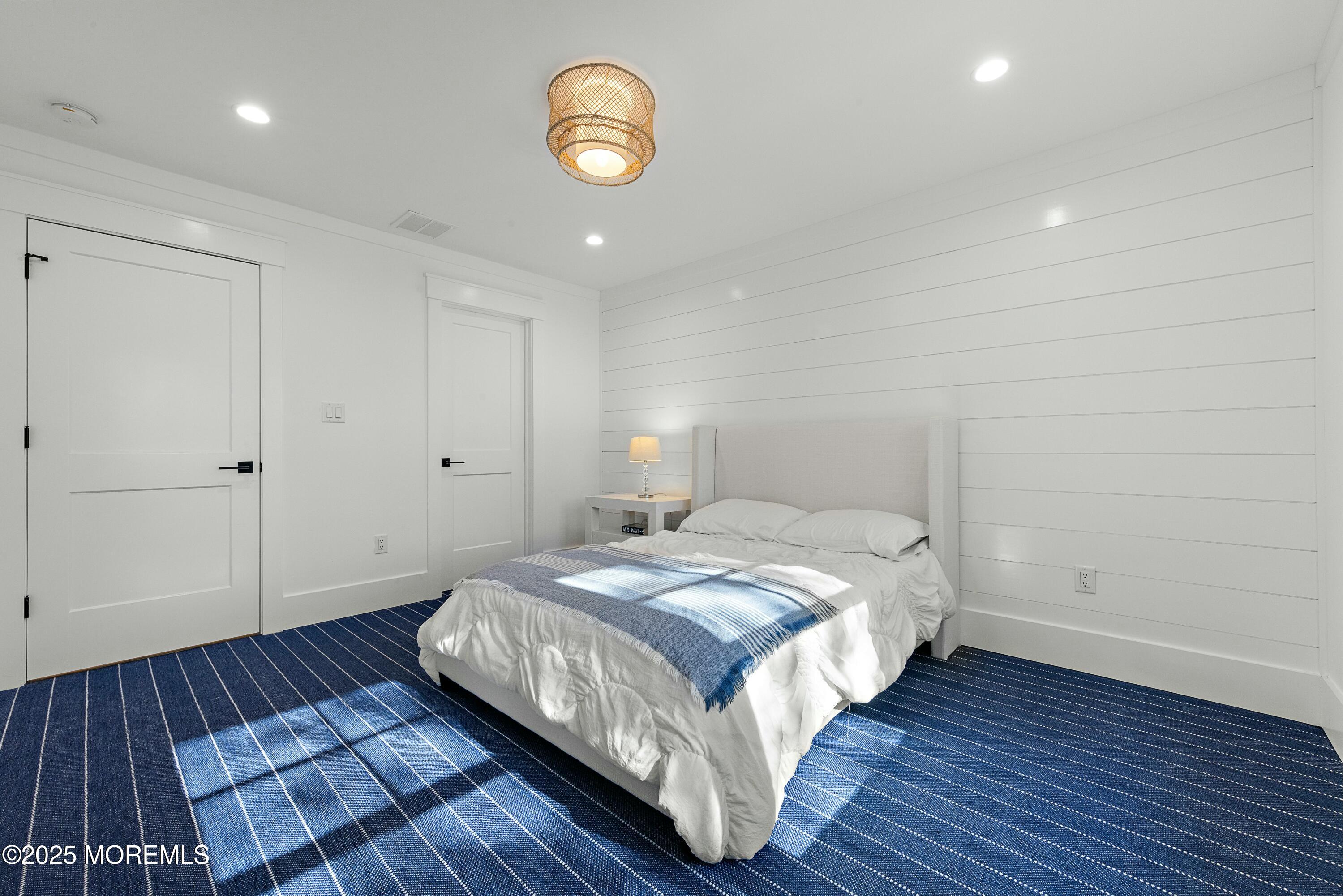 615 Harding Road Little Silver, NJ 07739 - Photo 54 of 94 a bedroom with a bed and wooden floor