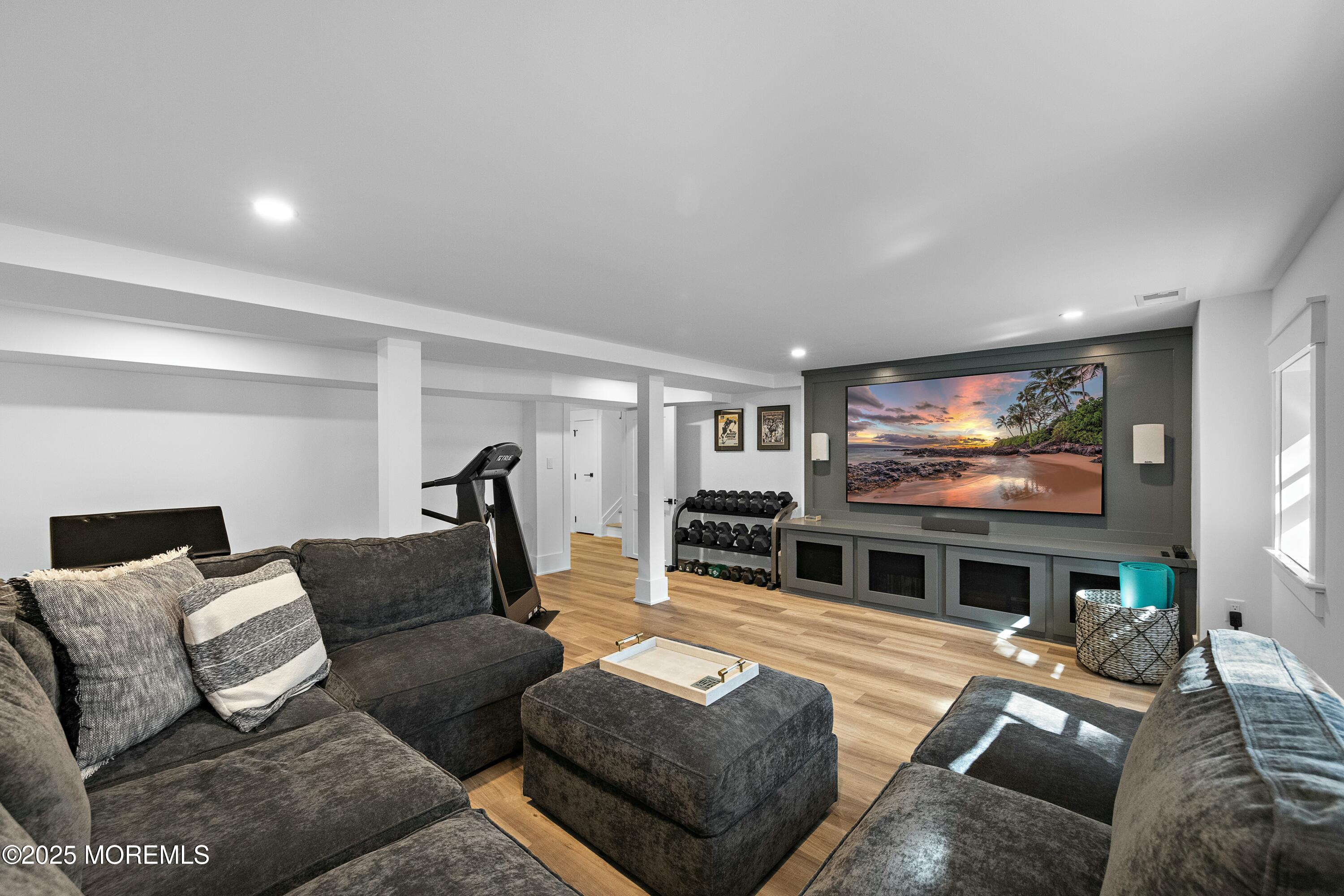 615 Harding Road Little Silver, NJ 07739 - Photo 58 of 94 a living room with furniture and a flat screen tv
