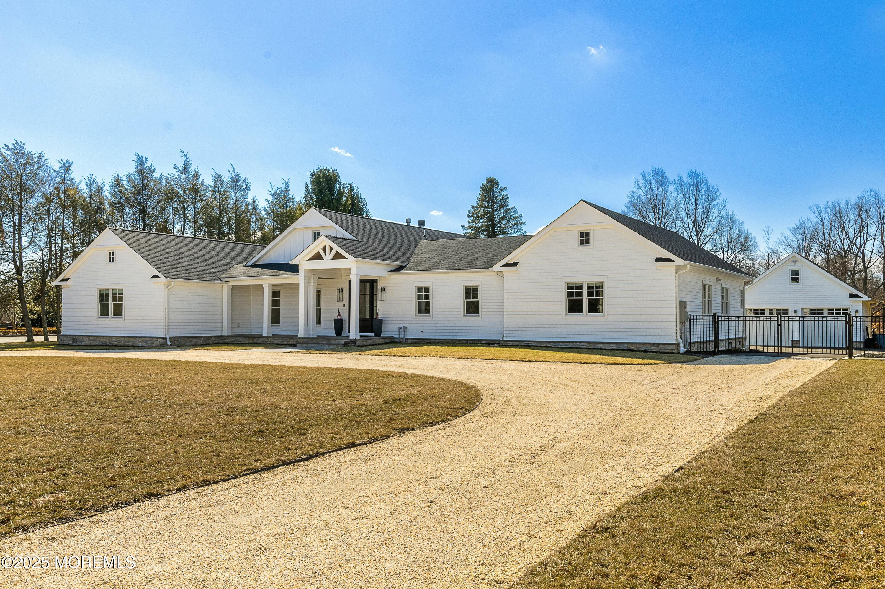 615 Harding Road Little Silver, NJ 07739 - Photo 77 of 94 a front view of house with yard and trees in the background