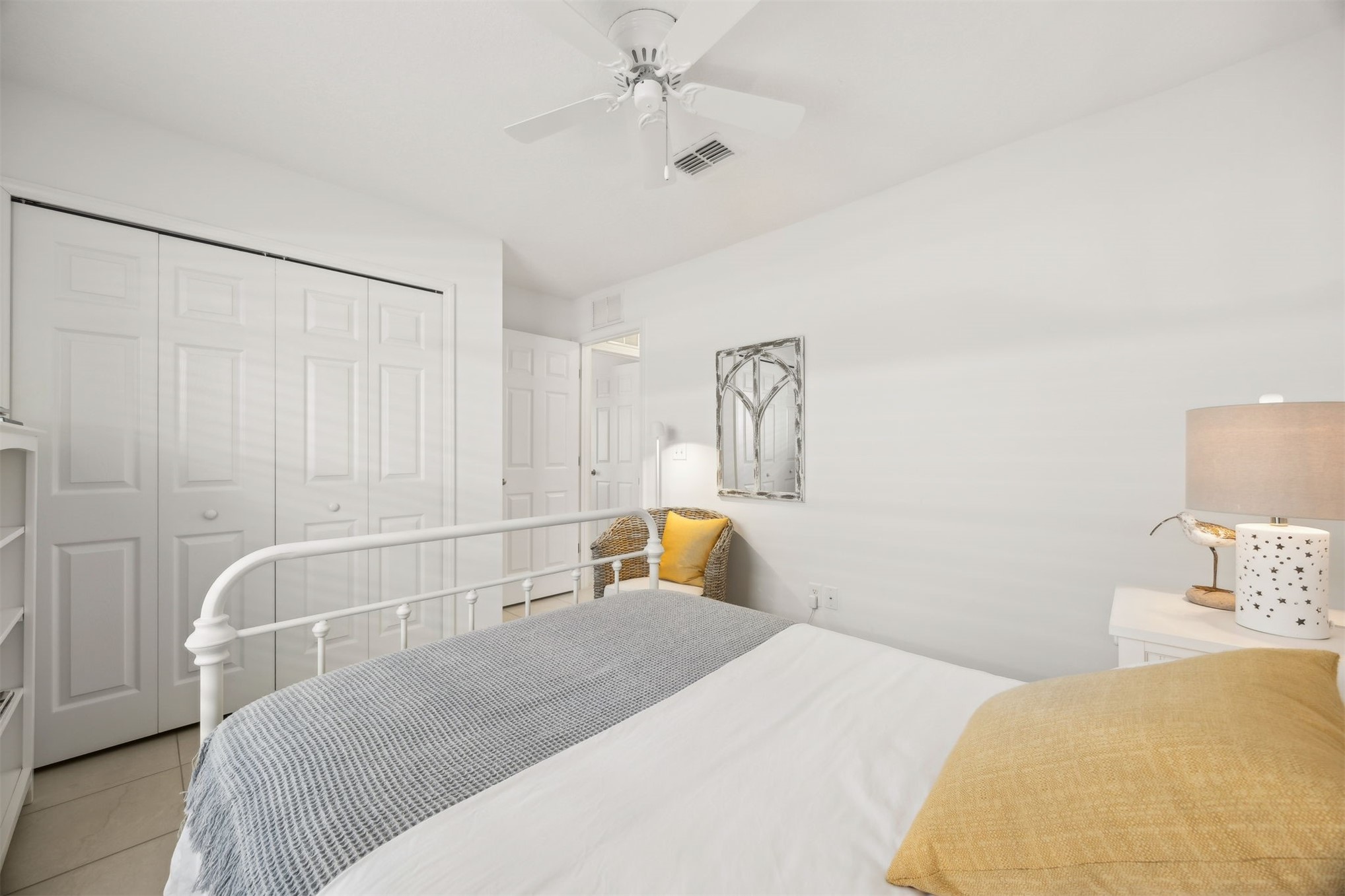 94037 Last Lane Yulee, FL 32097 - Photo 25 of 38 a bedroom with a bed and a chandelier
