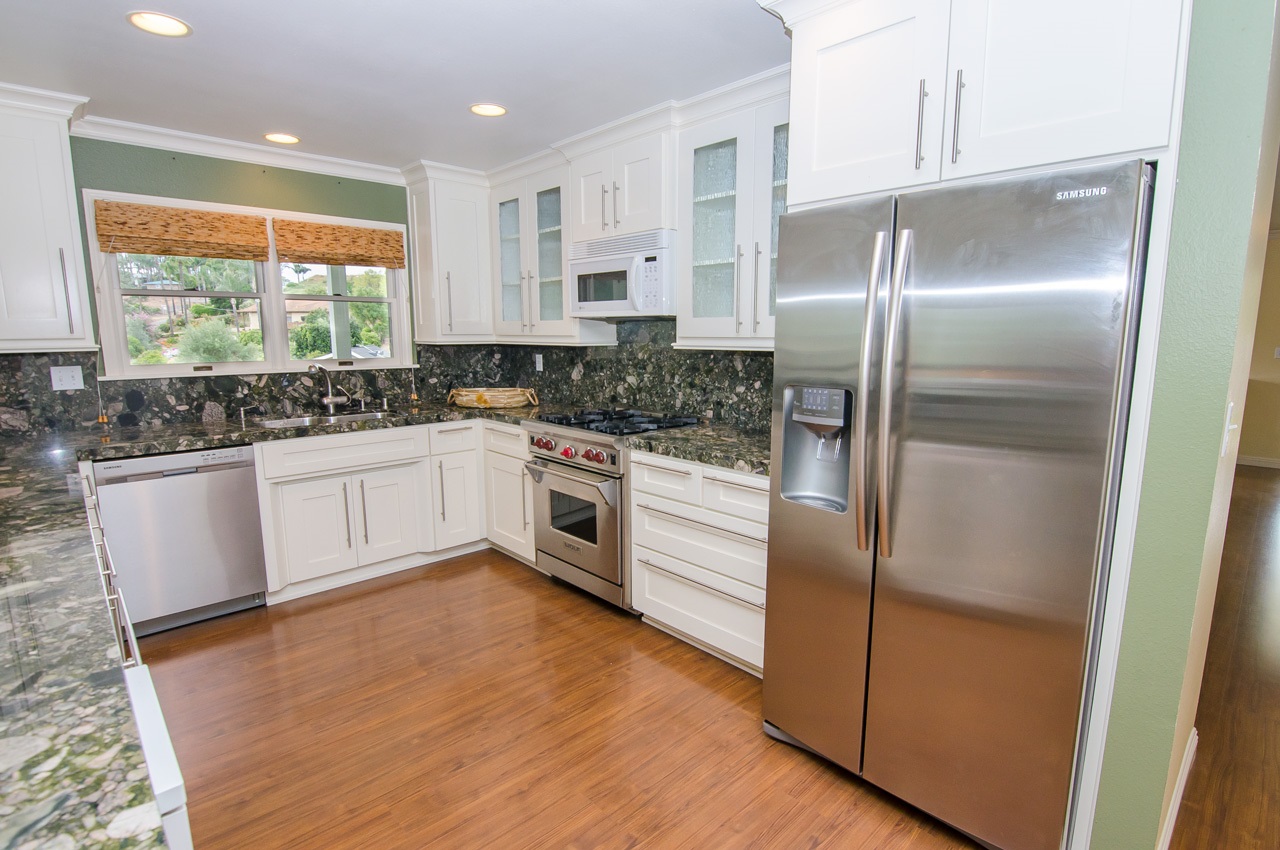 Beautiful cabinets, granite and Wolf range.