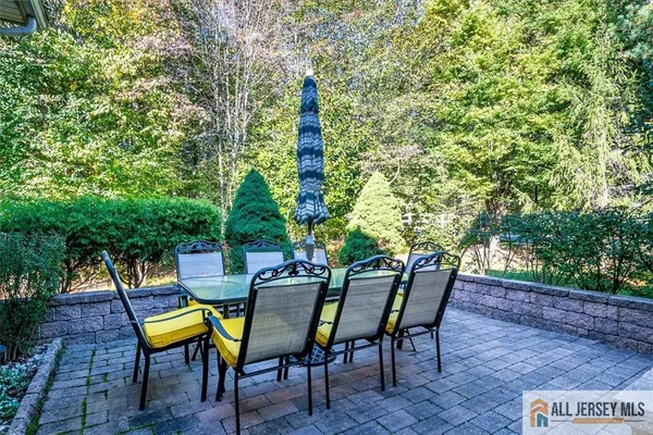 a view of a chairs and table in the patio