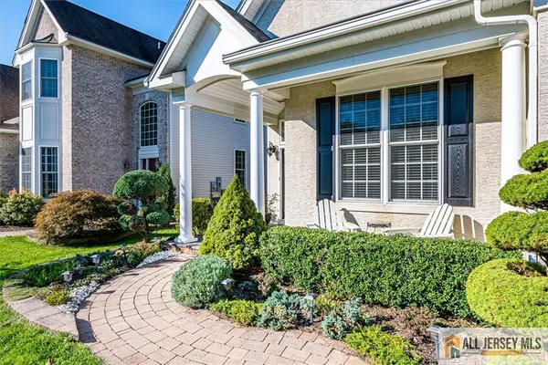 a view of a house with potted plants