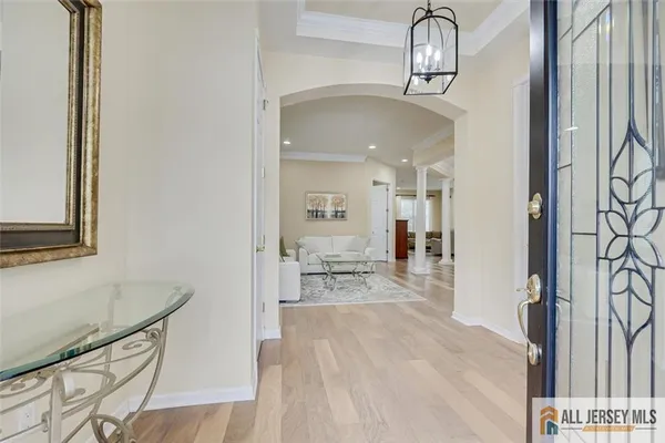 a hallway with a view of living room