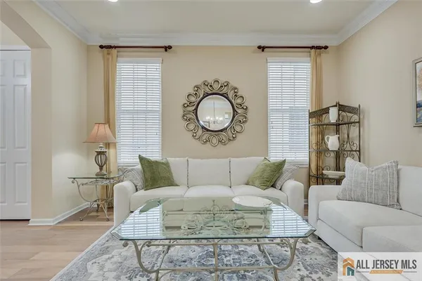 a living room with furniture a couch and a table