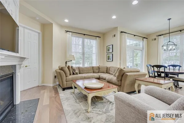 a living room with furniture and a fireplace