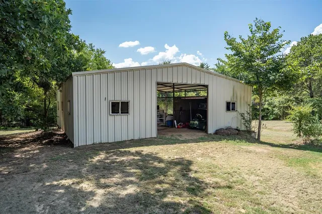 a view of a house with a yard and garage