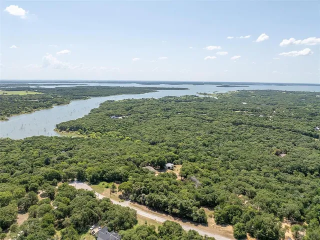 a view of a large body of water with a building in the background