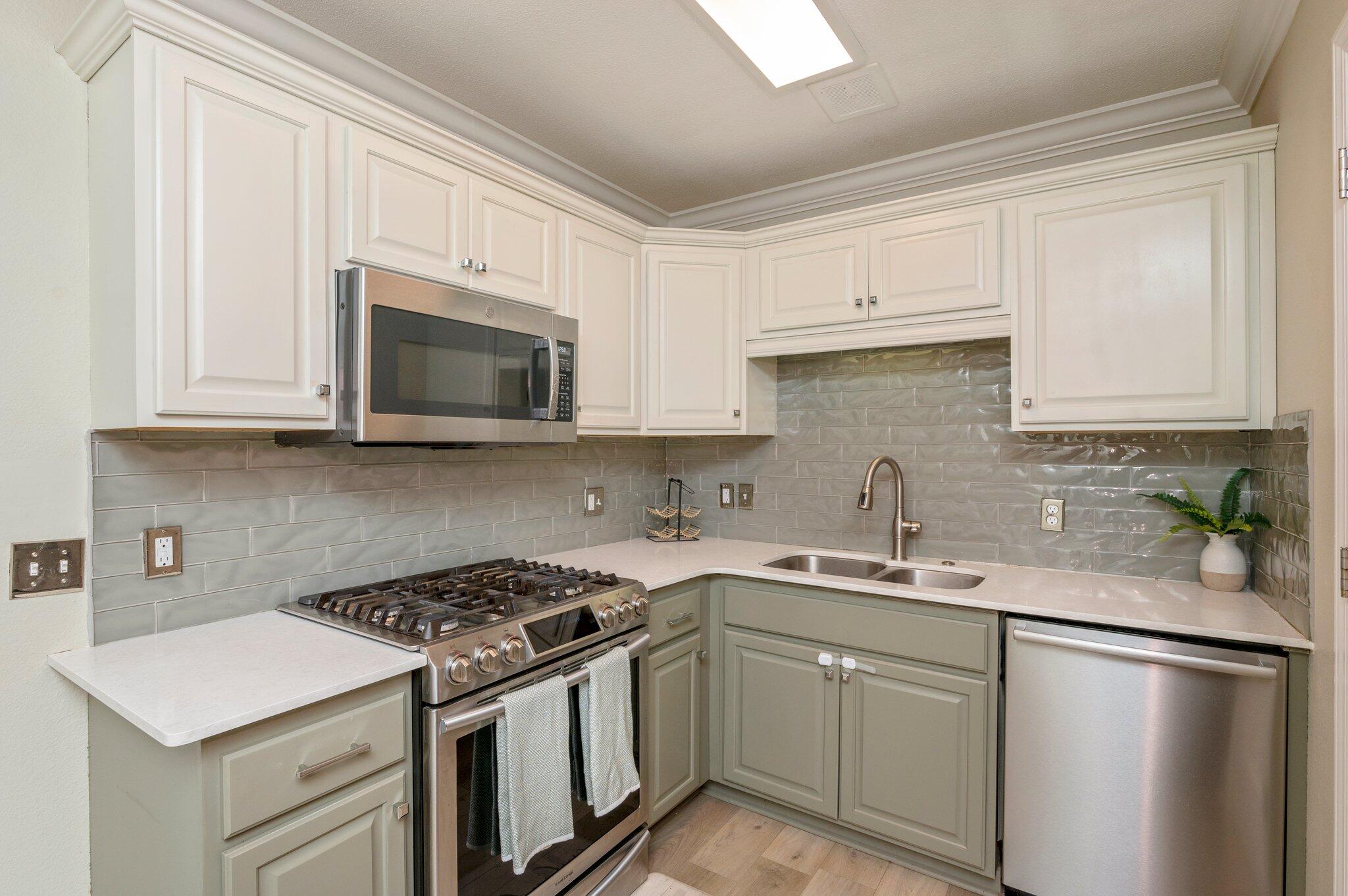 149 Shady Lane Crestview, FL 32536 - Photo 12 of 50 a kitchen with a sink stove top oven and cabinets