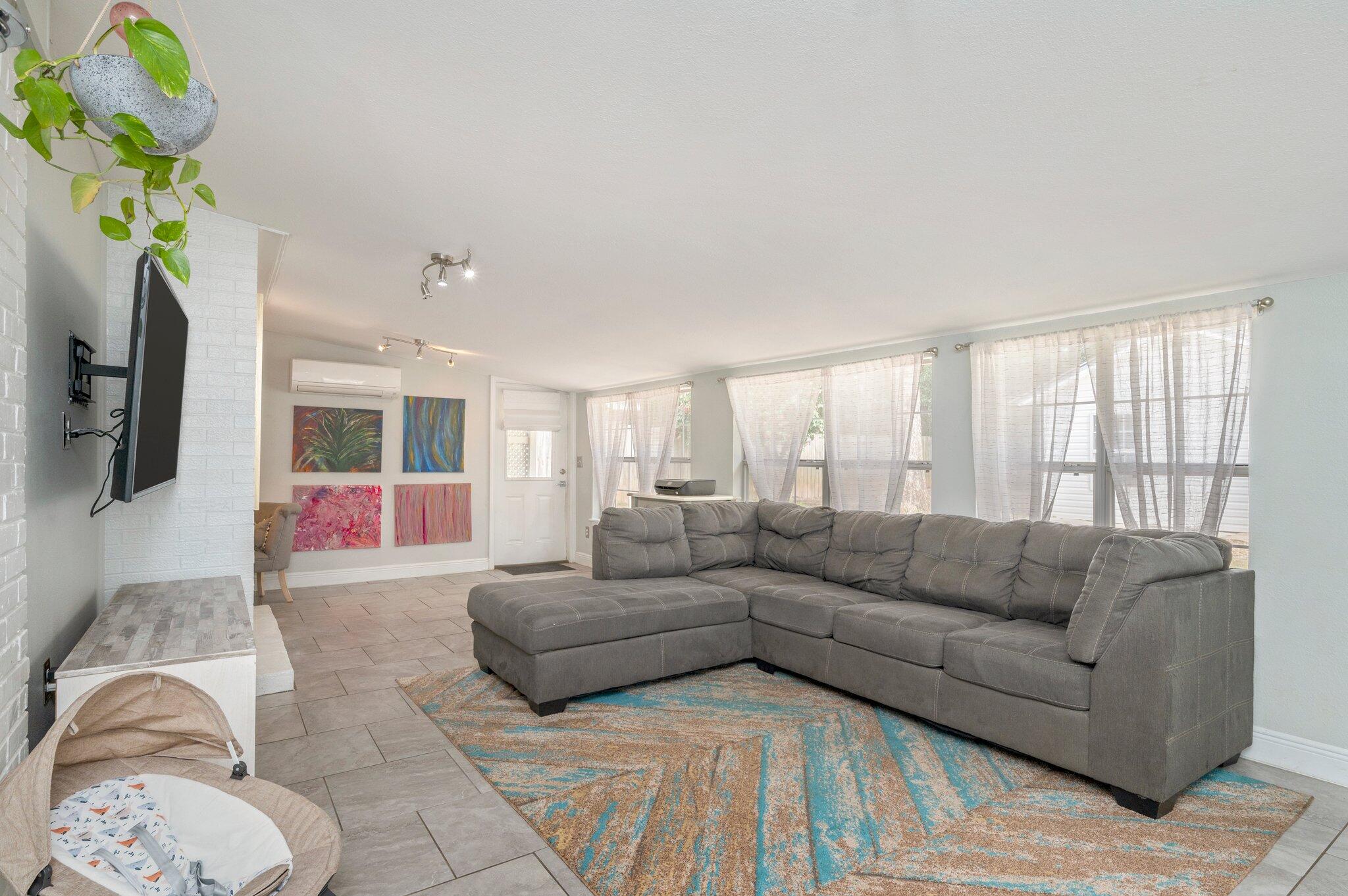 149 Shady Lane Crestview, FL 32536 - Photo 15 of 50 a living room with furniture a chandelier and a window