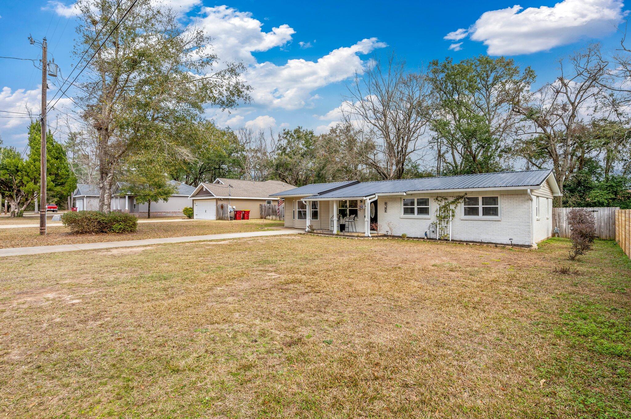 149 Shady Lane Crestview, FL 32536 - Photo 2 of 50 a front view of house with yard and trees
