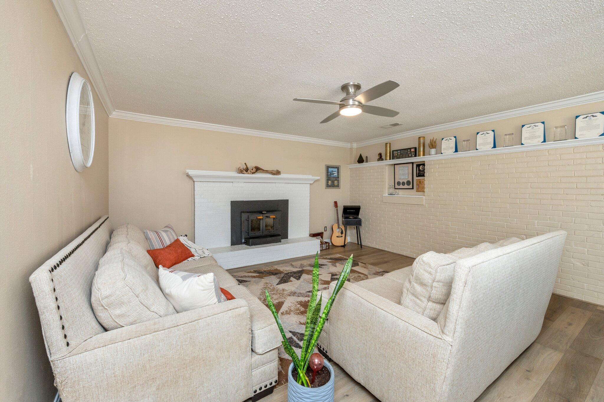 149 Shady Lane Crestview, FL 32536 - Photo 25 of 50 a living room with furniture fireplace and a flat screen tv