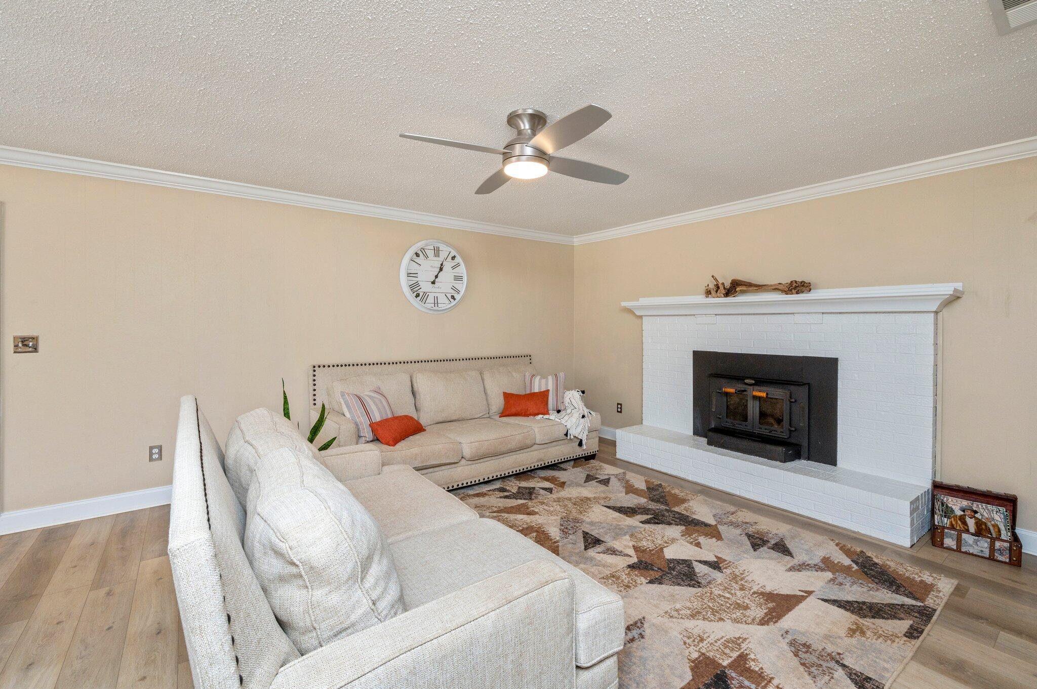 149 Shady Lane Crestview, FL 32536 - Photo 28 of 50 a living room with furniture and a fireplace
