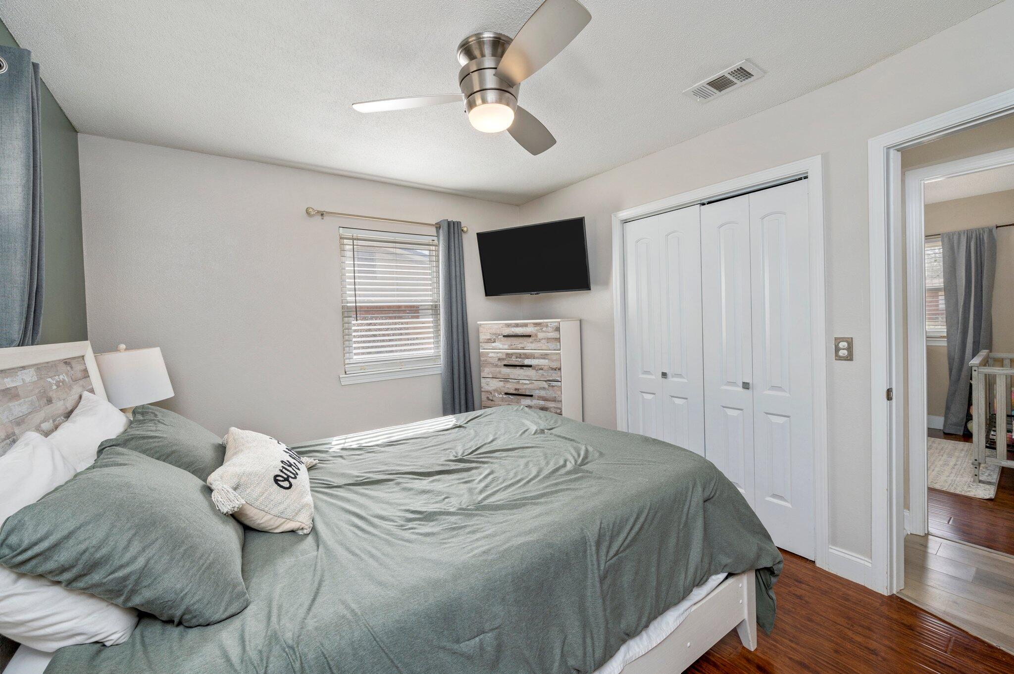 149 Shady Lane Crestview, FL 32536 - Photo 36 of 50 a bedroom with a bed and a flat screen tv
