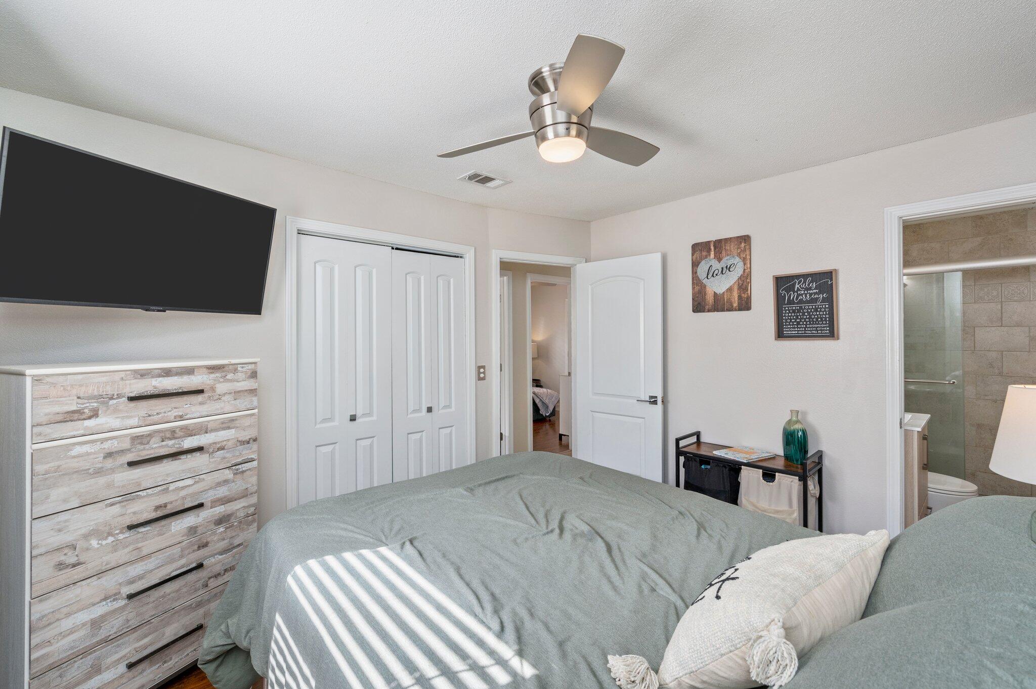 149 Shady Lane Crestview, FL 32536 - Photo 37 of 50 a bedroom with a bed and a flat screen tv