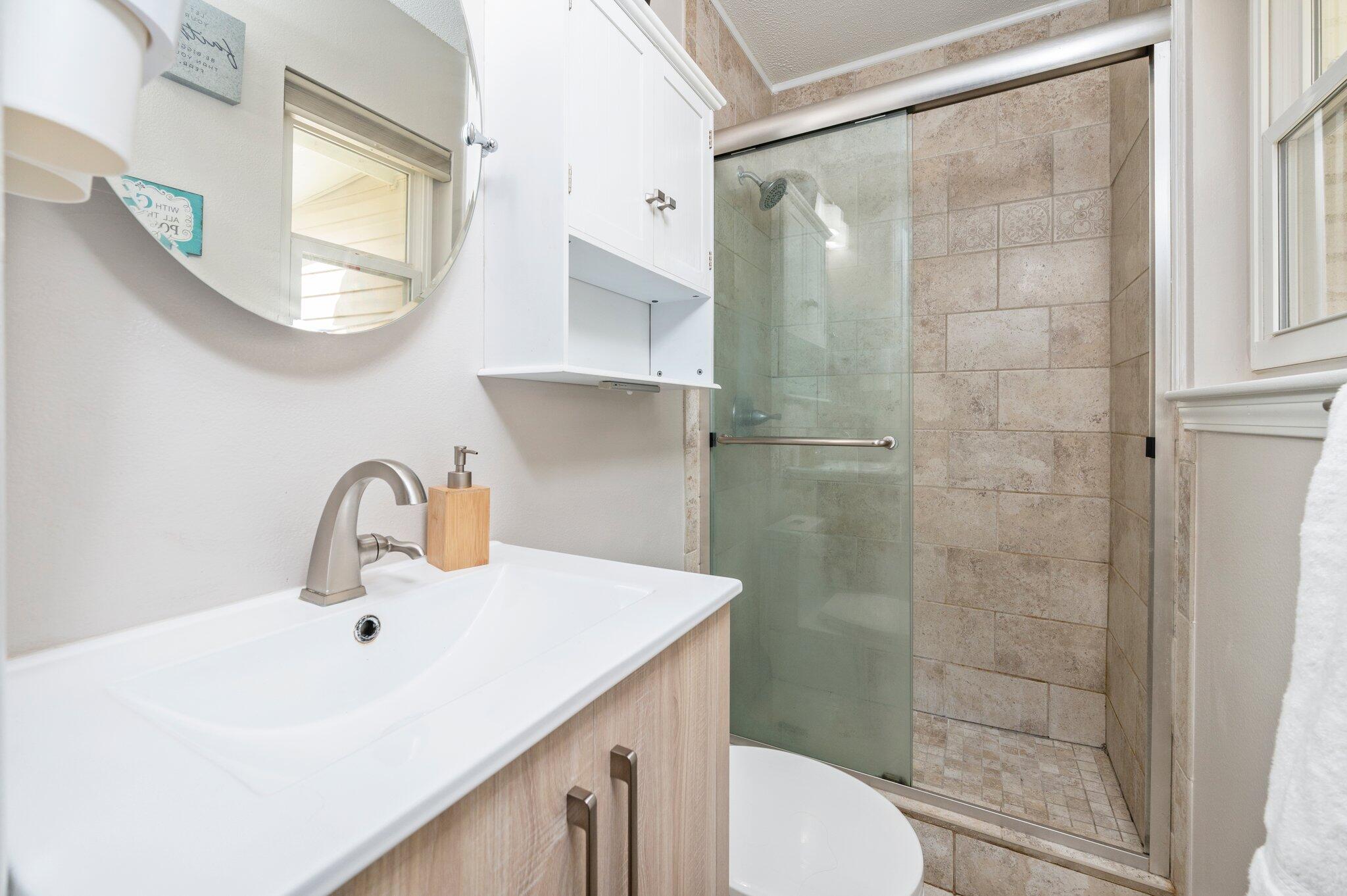 149 Shady Lane Crestview, FL 32536 - Photo 38 of 50 a bathroom with a sink vanity mirror and toilet