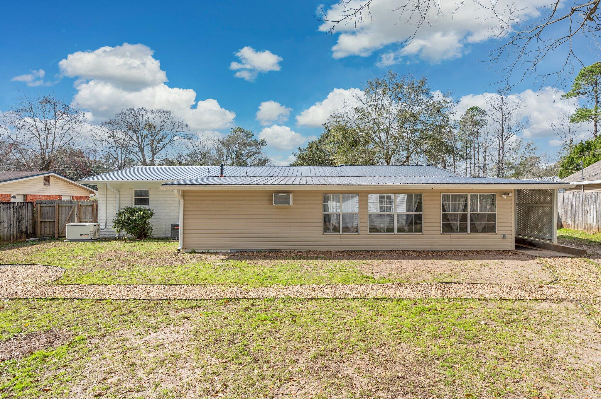 149 Shady Lane Crestview, FL 32536 - Photo 48 of 50 a front view of a house with a yard
