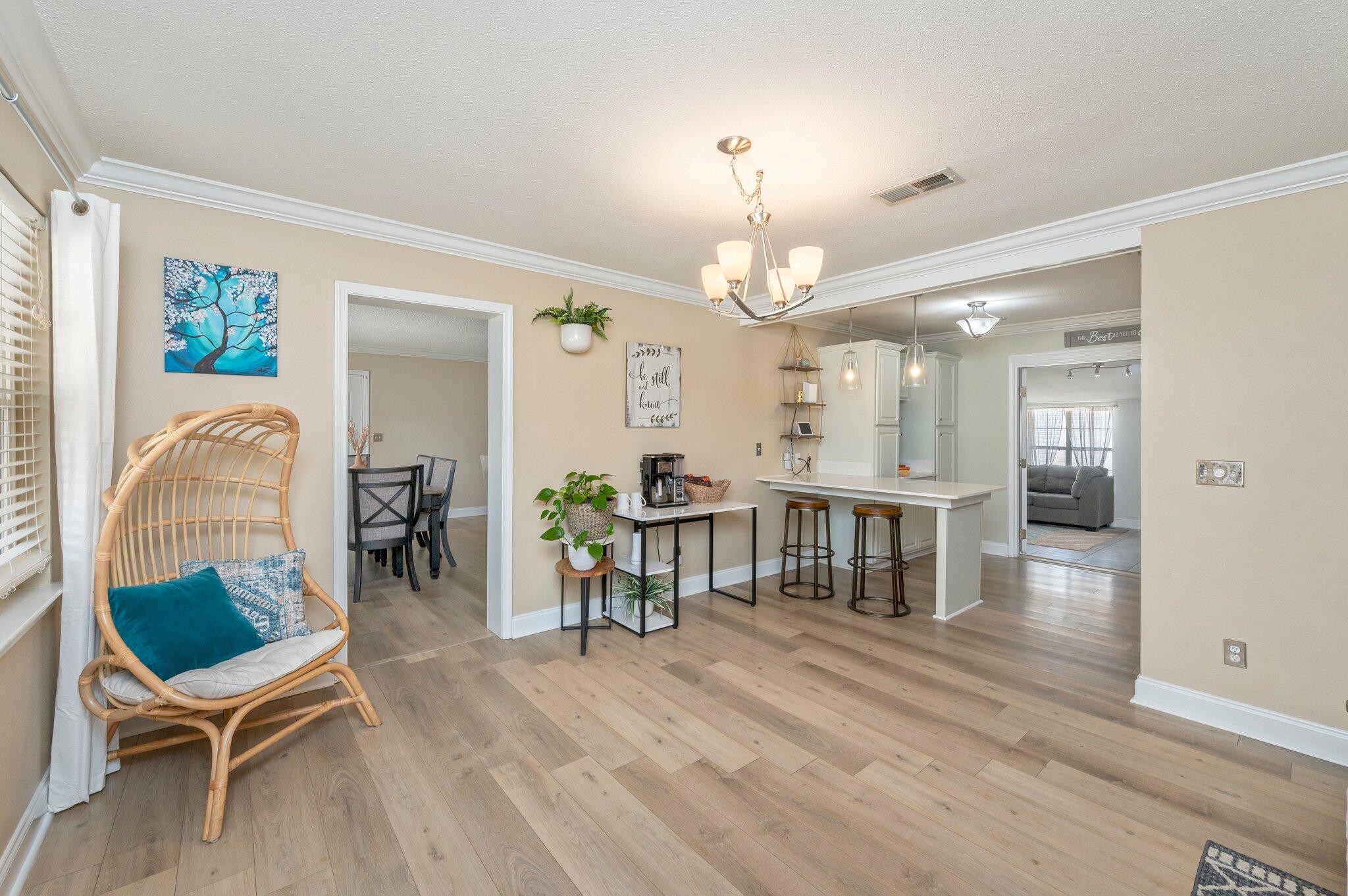 149 Shady Lane Crestview, FL 32536 - Photo 7 of 50 a view of a dining room with furniture and wooden floor