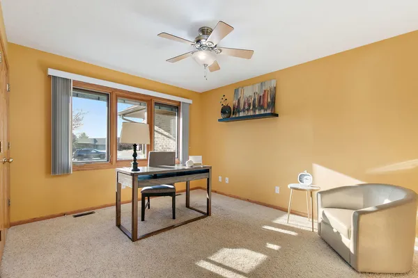 a work room with furniture and a window