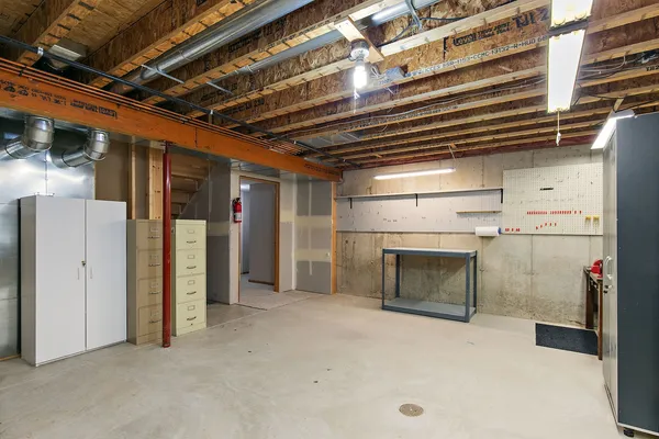a view of empty room with a fireplace