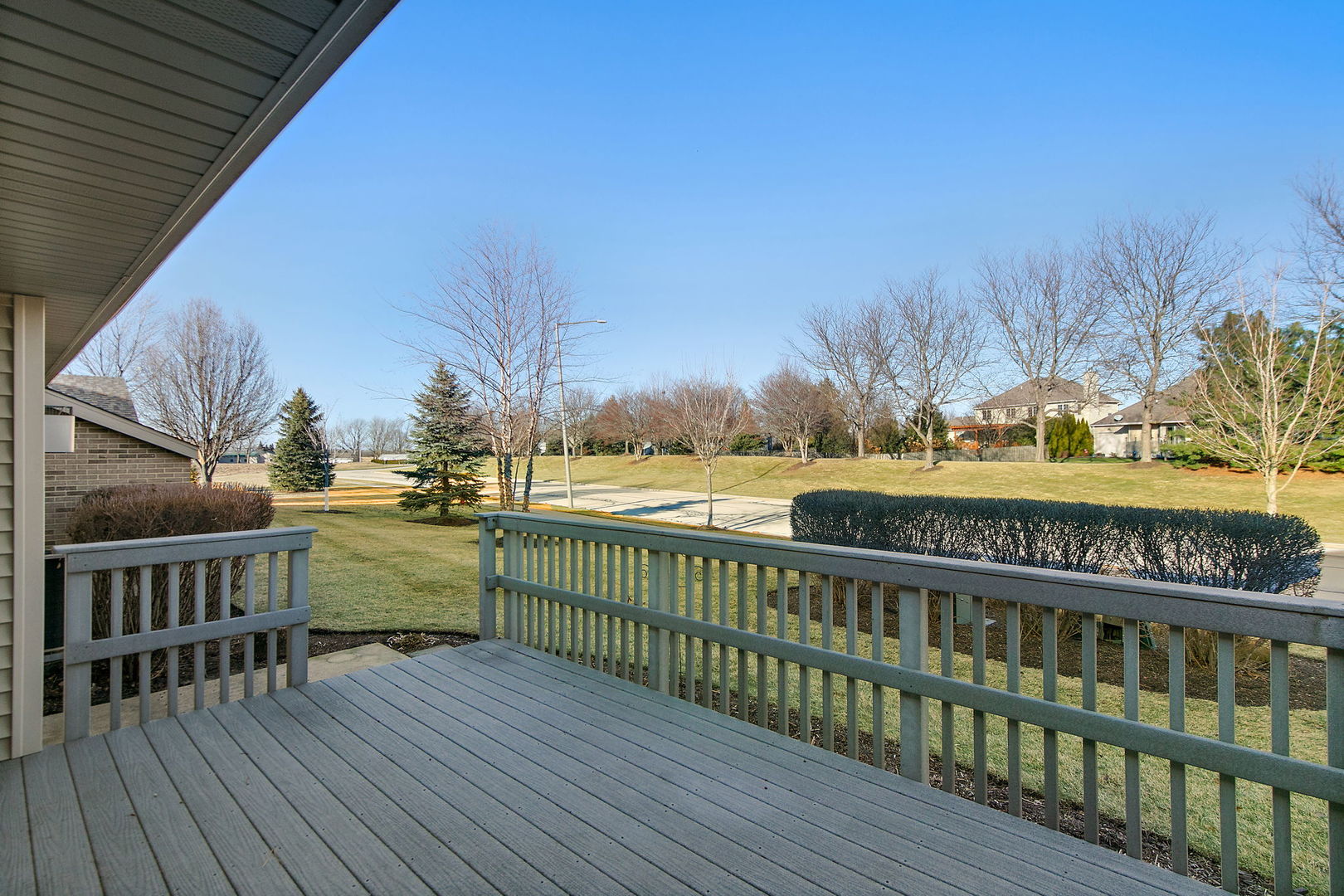 543 Brant Circle DeKalb, IL 60115 - Photo 27 of 28 a view of balcony with wooden floor and fence