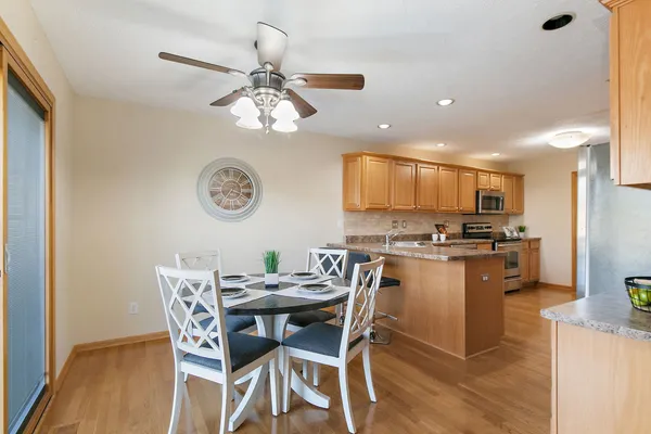 a view of a dining room with furniture and wooden floor