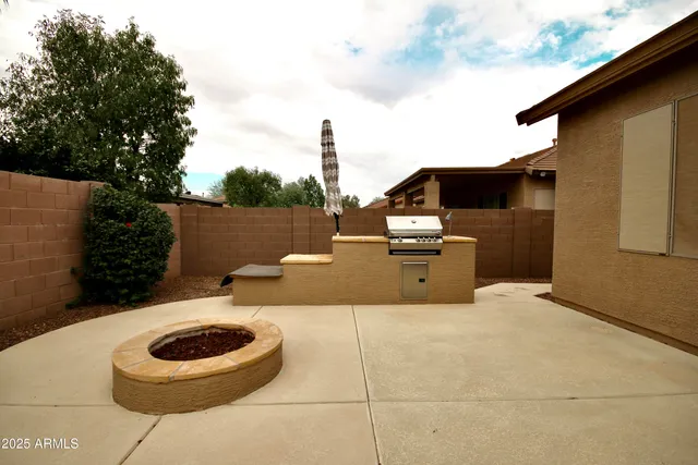a terrace of a house with outdoor seating