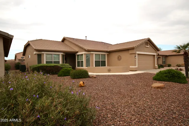 a house view with a garden space