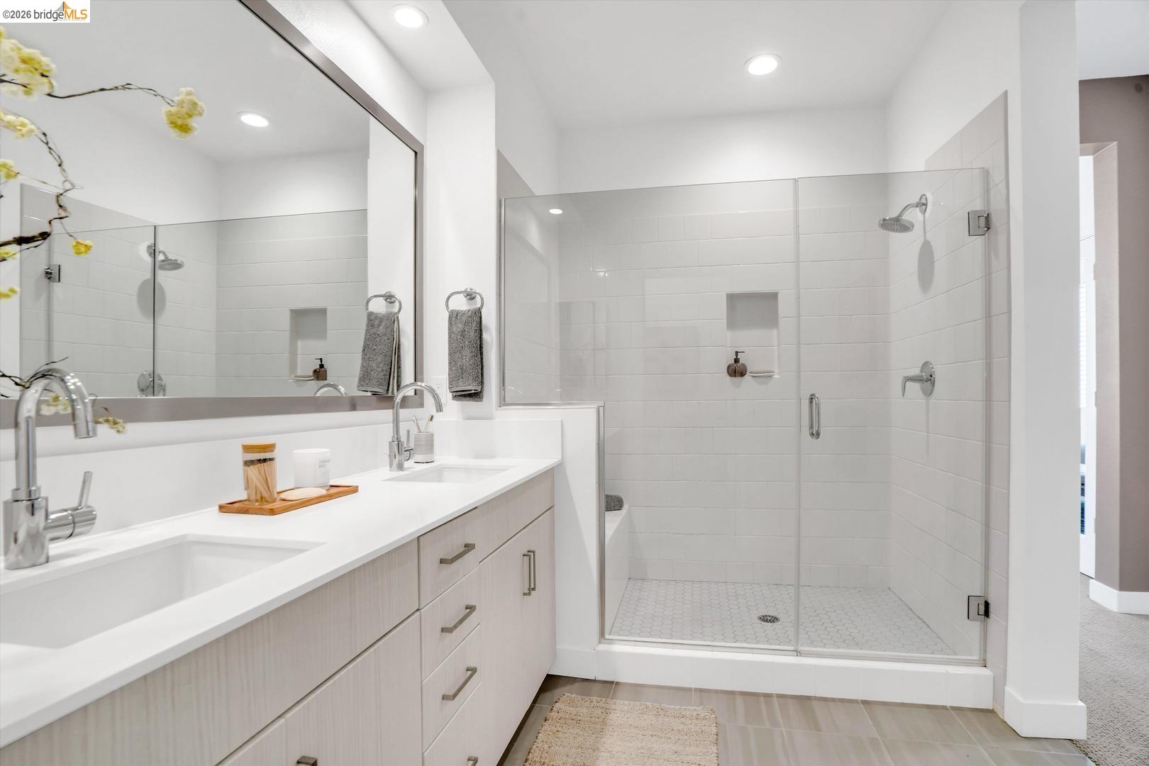 2229 Myrtle Street Oakland, CA 94607 - Photo 21 of 37 full bathroom with double vanity, a shower stall, and recessed lighting