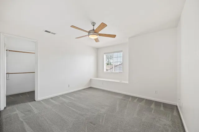 a view of a big room with carpet