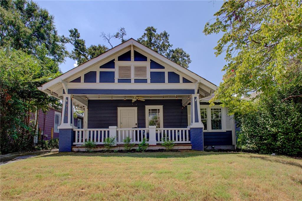 712 Catherine Street Southwest Atlanta, GA 30310 - Photo 1 of 1 a view of a house with wooden deck and a yard