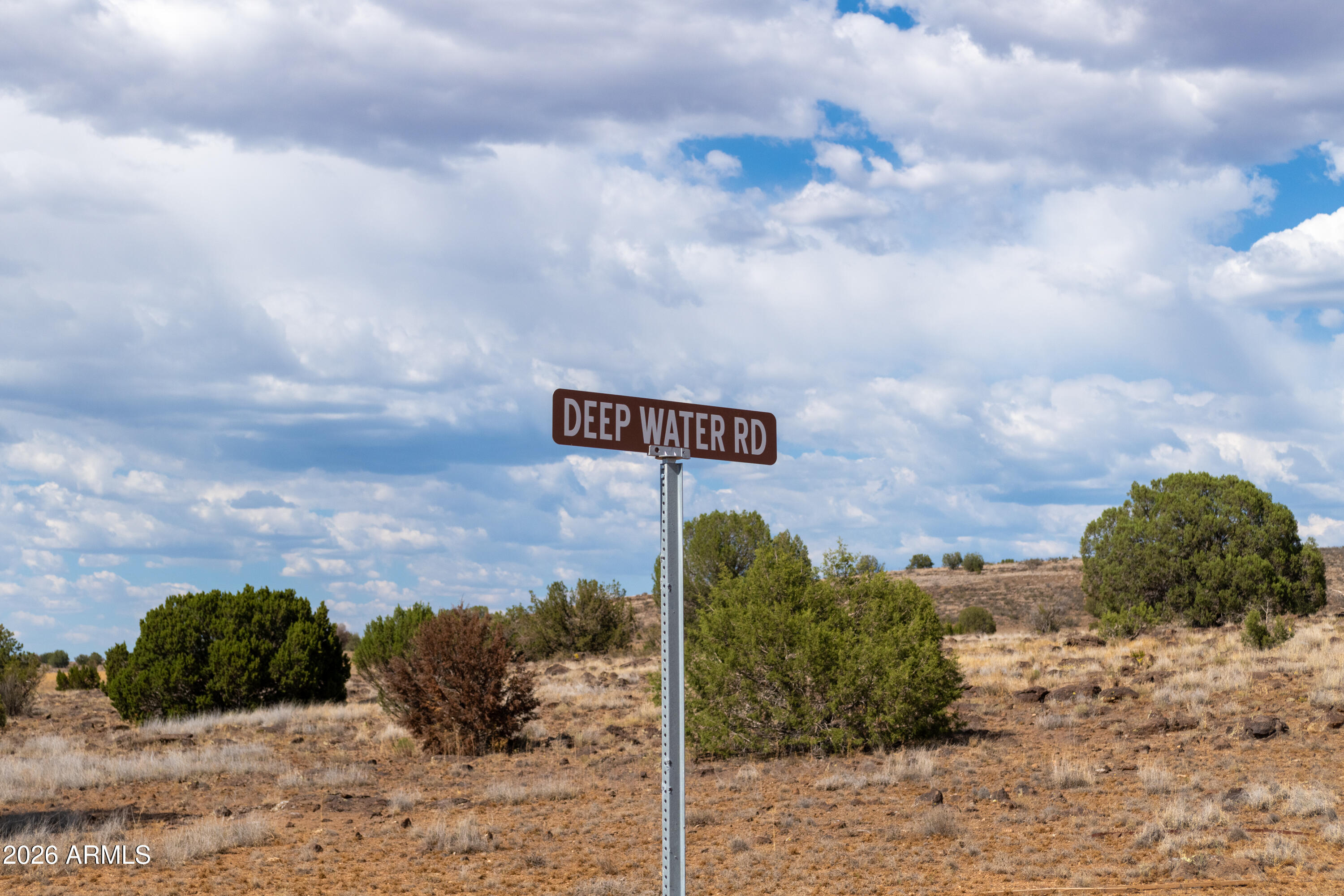 2.13-acres North Headwaters Road, Unit 7 Paulden, AZ 86334 - Photo 4 of 17 a view of a dry yard with wooden fence