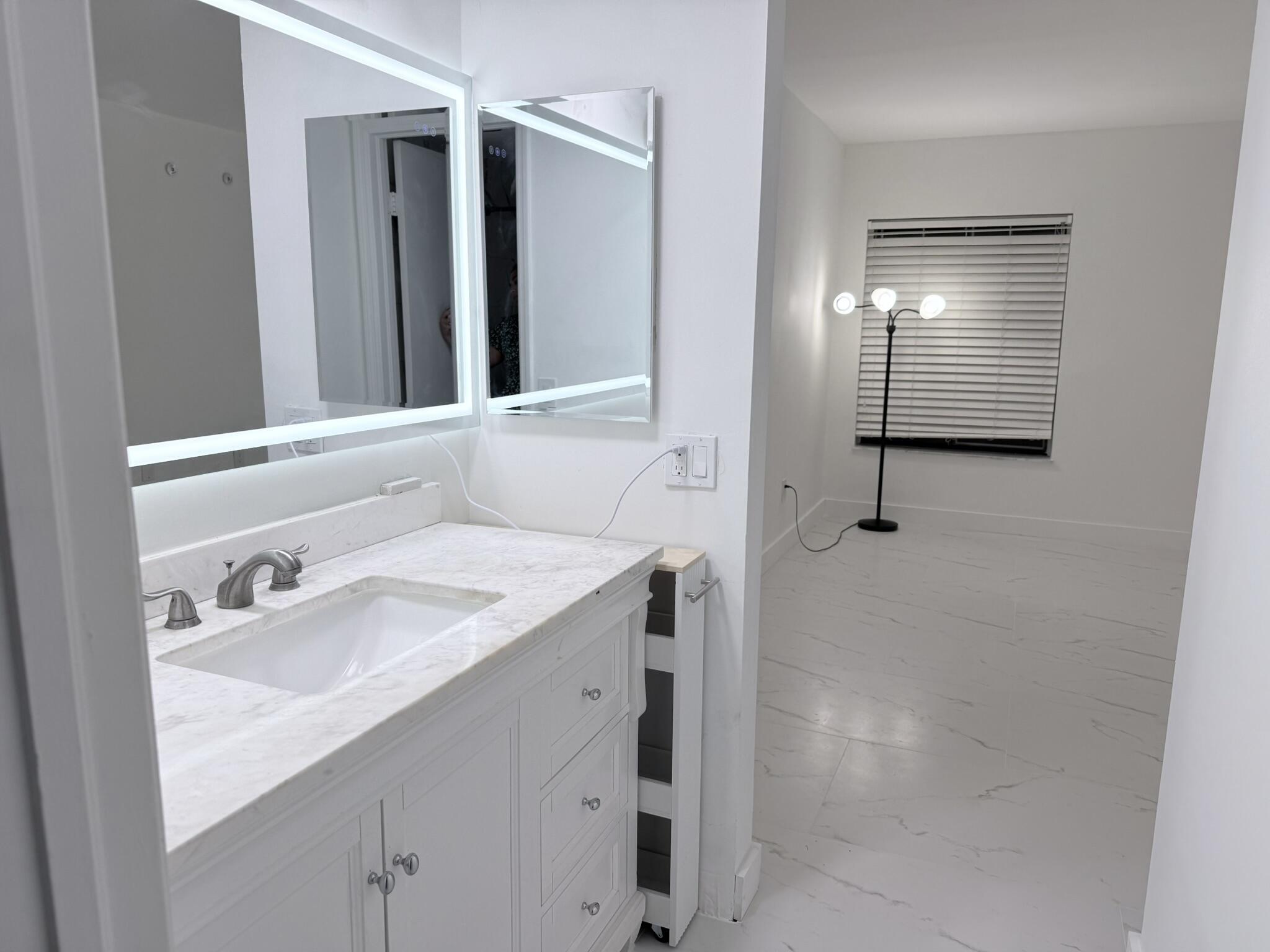 300 East Club Circle, Unit 107 Boca Raton, FL 33487 - Photo 8 of 16 Master bath sink