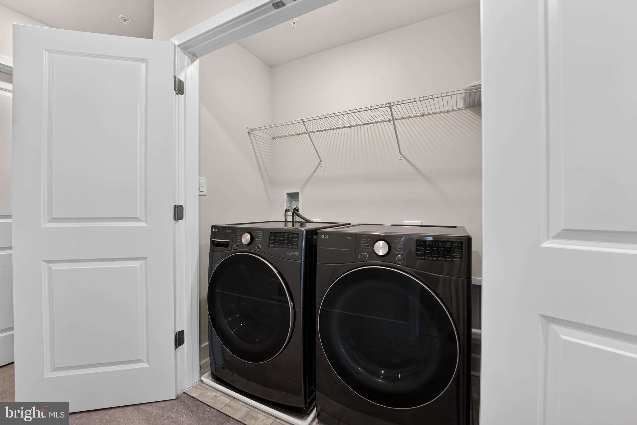 1808 Parham Way Baltimore, MD 21244 - Photo 27 of 31 Sleek laundry space with modern appliances.