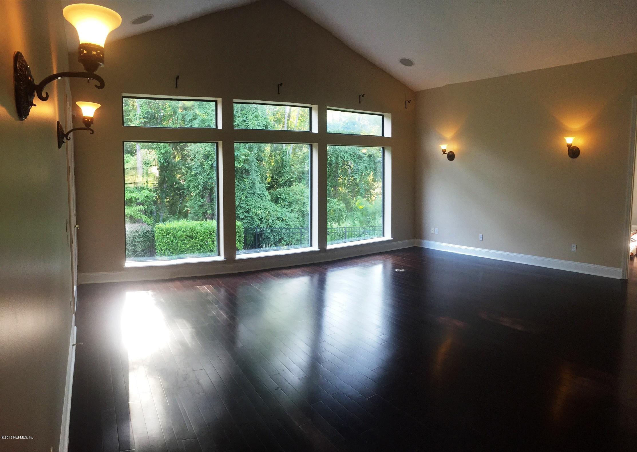 829 Riley Lane St. Augustine, FL 32095 - Photo 7 of 53 a view of empty room with wooden floor and fan