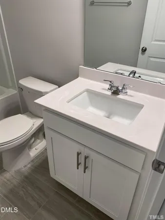 a bathroom with a sink and a toilet